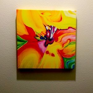 Multi-color paint pour on canvas.